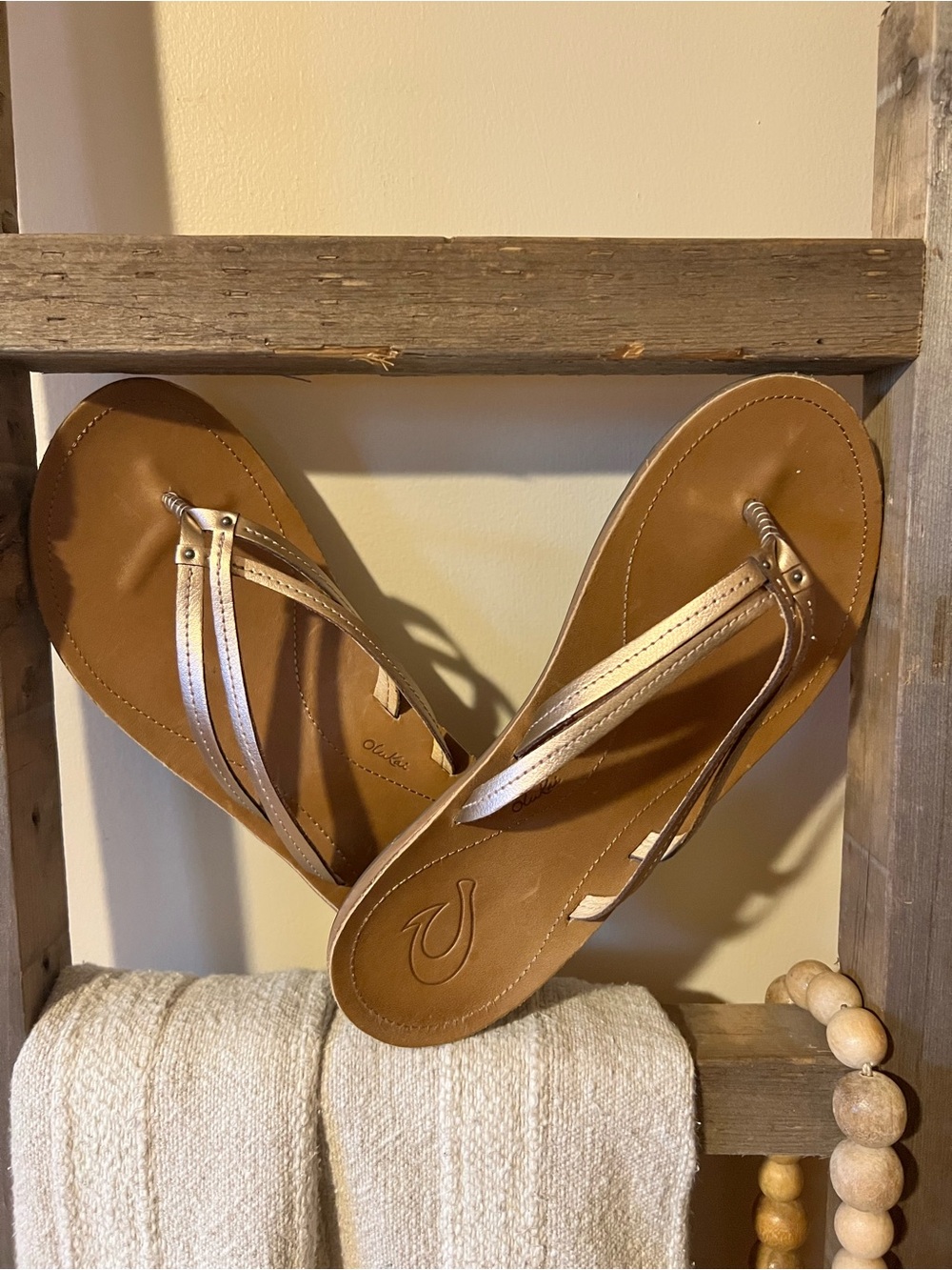 Olukai Women's Kapehe Luana sandals in bubbly and sahara metallic gold